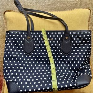 Micheal Kors.  Black with white dots. Red inside excellent condition